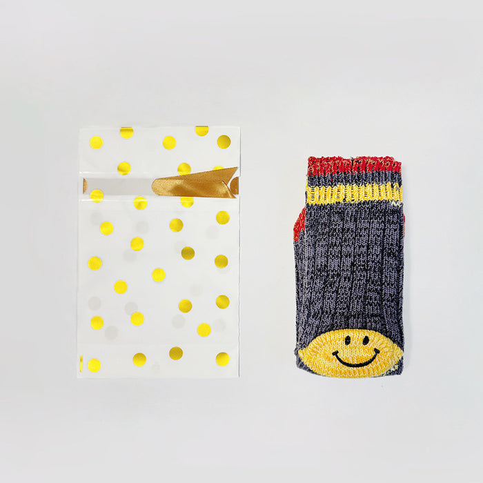 One Gold Dot Gift Bag in small size with one pair of socks, showing the size comparation.