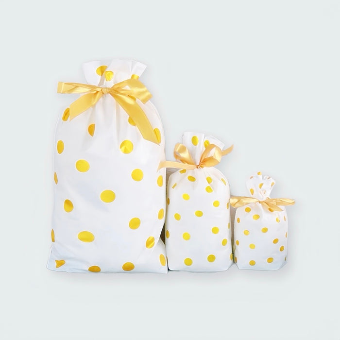 Folded view of Gold Dot Gift Bag in 3 different sizes, showcasing the size comparation.