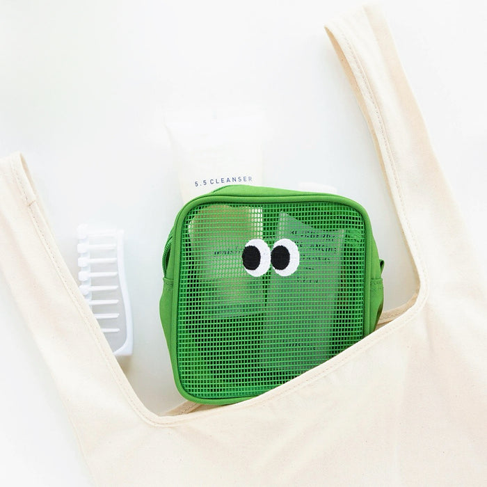 Green Googly Eyes cube mesh pouch in canvas tote; see-through zip organizer for toiletries and quick finds.