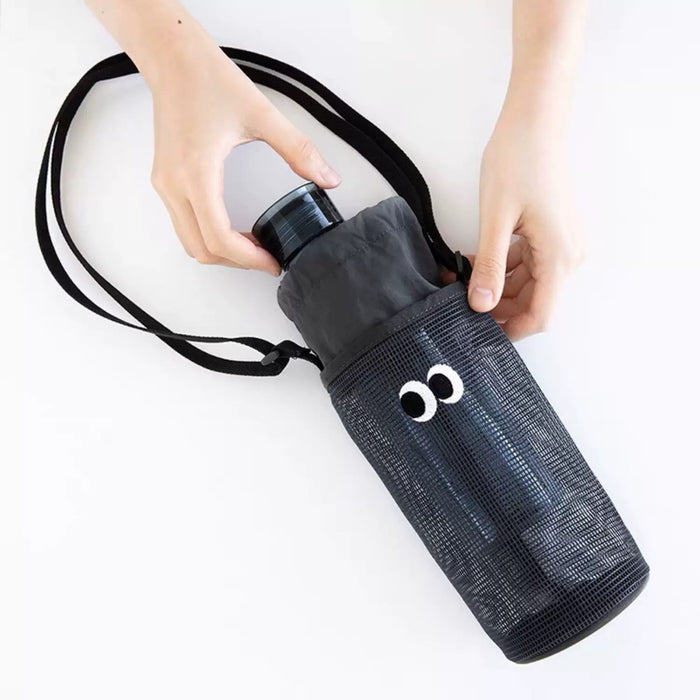 Model carrying a black polyester bag as crossbody, ideal for city walks and gifting.