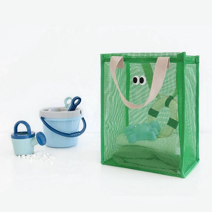 Flat lay of Googly Eyes Mesh Shopper Bag in green, great for everyday carry and travel.