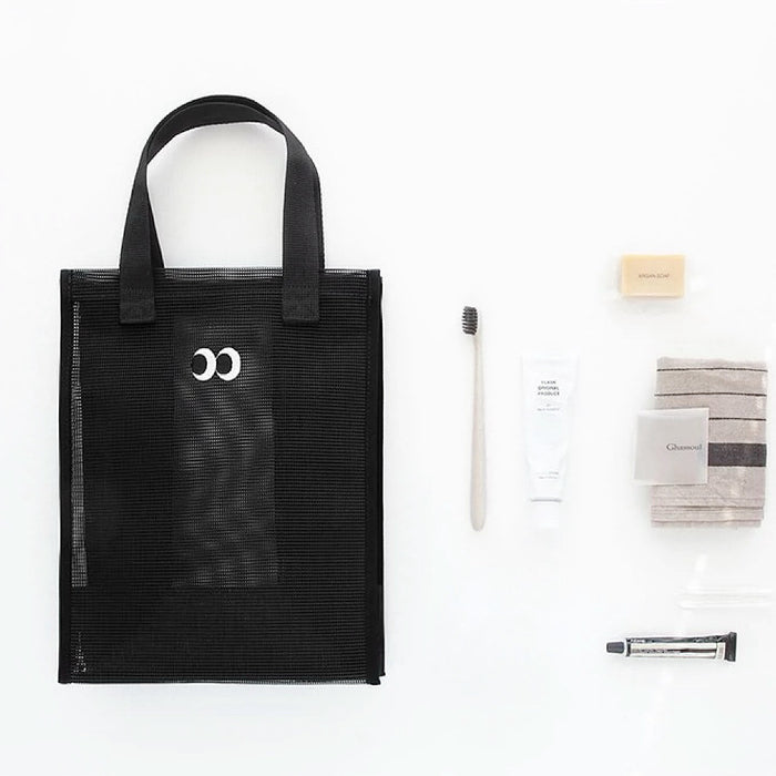 Folded view of Googly Eyes Mesh Shopper Bag in black, easy for commuting and weekends.