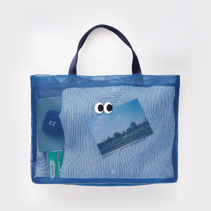 Folded view of Googly Eyes Mesh Tote Bag in navy blue, easy for commuting and weekends.