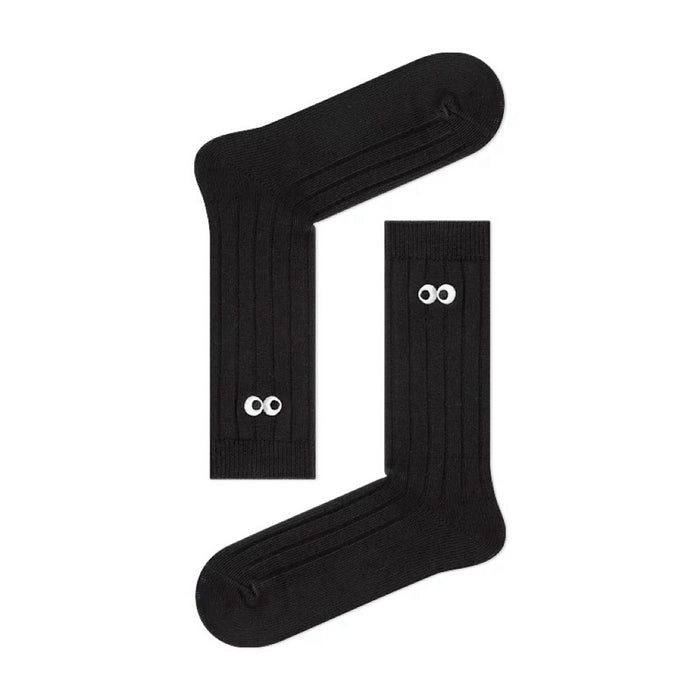 Folded view of Googly Eyes Socks in black, ideal for workouts and commuting.