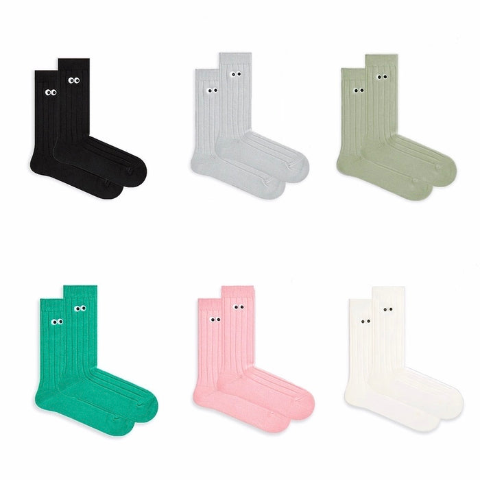 Front view of 6 colors of Googly Eyes Socks, easy to pack for travel and errands.