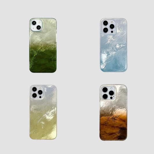 Four silicone iPhone cases with gradient glacier texture in green, blue, yellow, and brown. 3D ripple design.