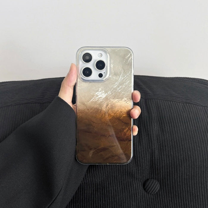 Model holding brown Gradient Glacier Case. Earth-toned 3D glacier ripples for a sophisticated look.