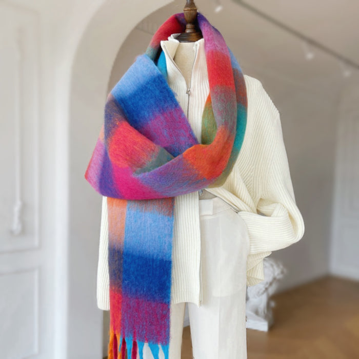 Flat lay of Oversized gradient plaid scarf with rainbow colors and fringed edge.