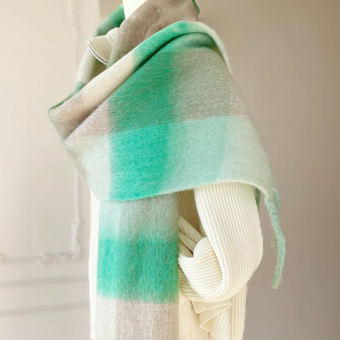 Model wearing a green and grey gradient plaid scarf, ideal for daily wear and travel.