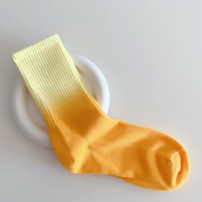 Front view of Gradient Rainbow Socks in orange and yellow, easy to pack for travel and errands.