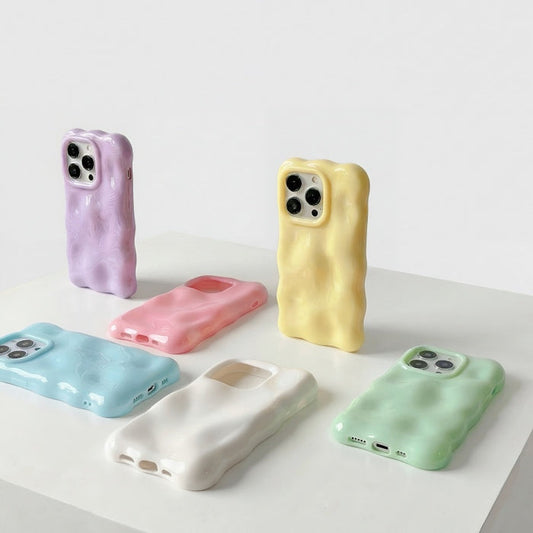 Aesthetic 3D textured melting effect phone covers displayed in a variety of trendy shades.