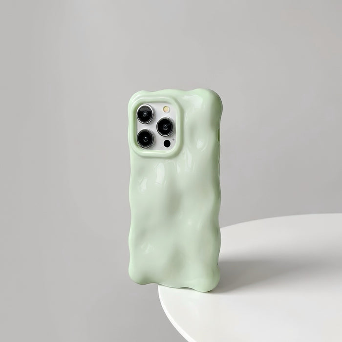 Mint green 3D wavy silicone case with a soft gummy feel, perfect for a fresh aesthetic.