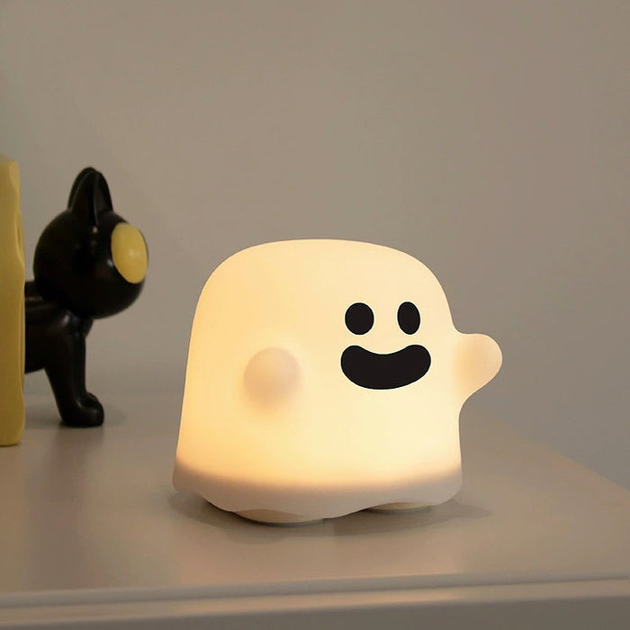 Side view of Halloween Ghost Lamp with smile face  on table, great for home decor and gifting.