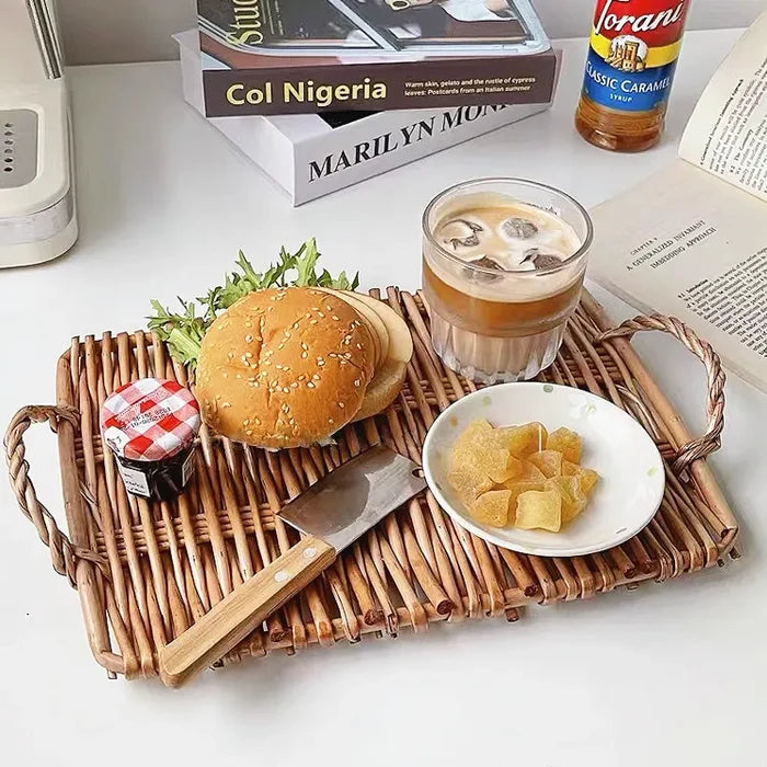 Close-up of Hand Woven Rattan Tray with Hamburger and coffee on it.