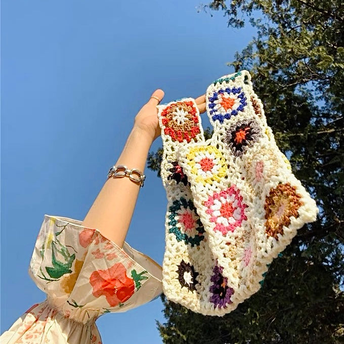 Model carrying a apricot Handmade Crochet Flower Grid Bag in hand , great for daily carry and travel.