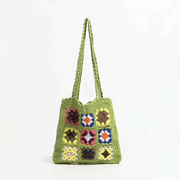 Flat lay of Handmade Crochet Flower Grid Shoulder Bag in green, great for everyday carry and travel.