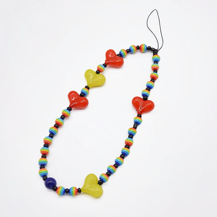 Front view of Heart Beat Phone Charm in red, ideal for travel and daily use.