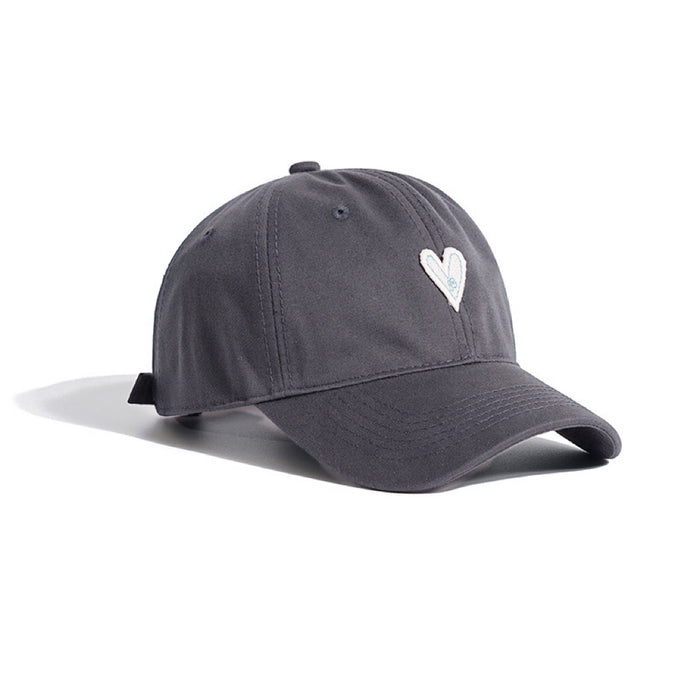 Grey cotton twill cap with white heart embroidery on a white background.