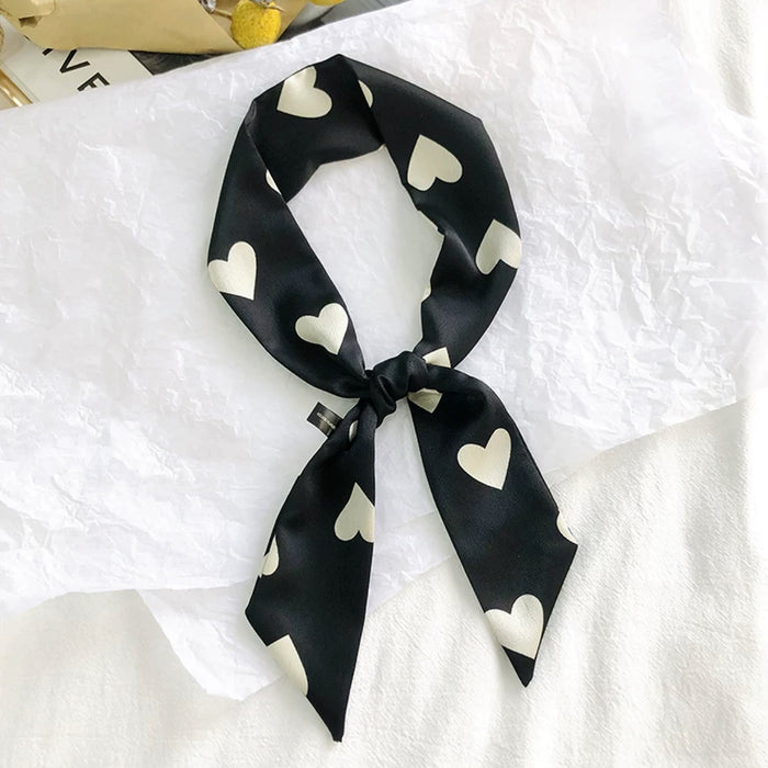 Close-up of Heart Pattern Skinny Scarf in navy and black, ideal for everyday styling and weekend outings.