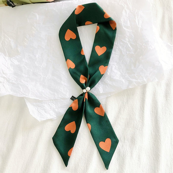 Model wearing a polyester scarf in green and orange, ideal for daily wear and travel.