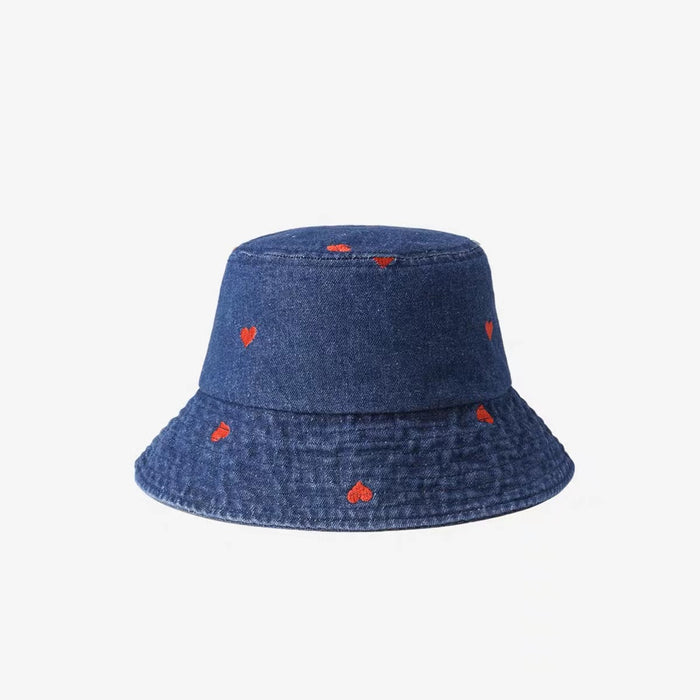 Front view of Heart Printed Bucket Hat in dark blue, crafted from rugged denim with playful heart motifs for travel.