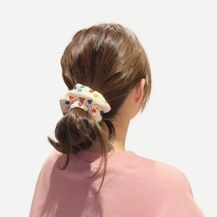 Model wearing Heart Printed Scrunchie, great for everyday styling and gifting.