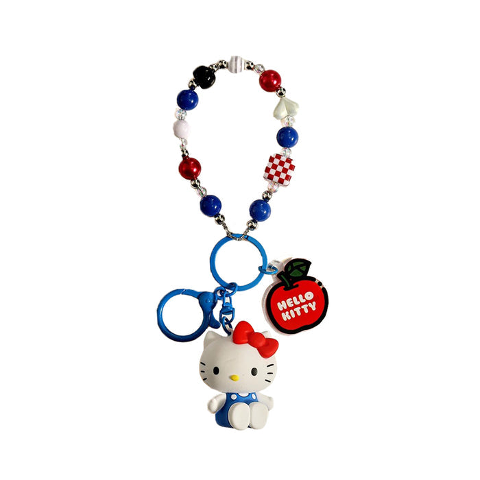 Front view of Hello Kitty bag charm with red apple tag and colorful beaded strap.
