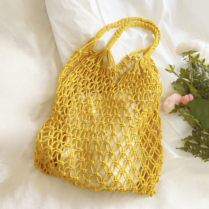 Folded view of Hollow Crochet Tote Bag in yellow, easy for commuting and weekends.