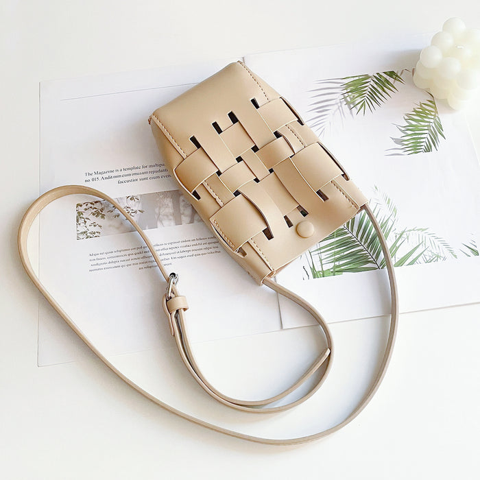 Folded view of Hollow Design Woven Leather Crossbody Bag in apricot, easy for commuting and weekends.