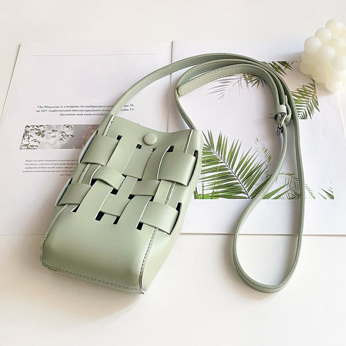 Angled view of Hollow Design Woven Leather Crossbody Bag in green, great for everyday carry and travel.