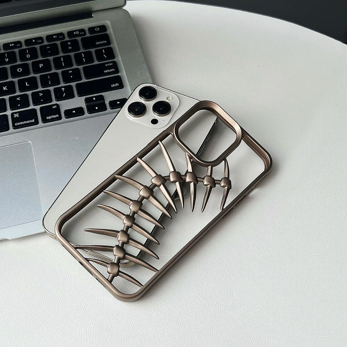 Bronze hollow fishbone silicone phone case for iPhone, showcasing its unique skeletal artistic design.