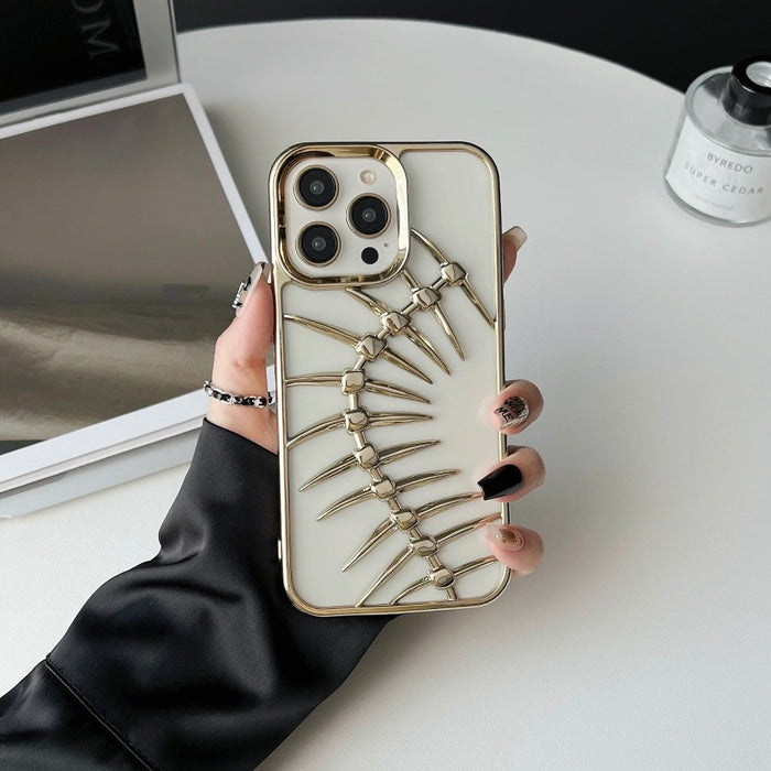 Model holding Hollow Fishbone Phone Case in polish gold. Artistic metallic finish for a luxury fashion look.