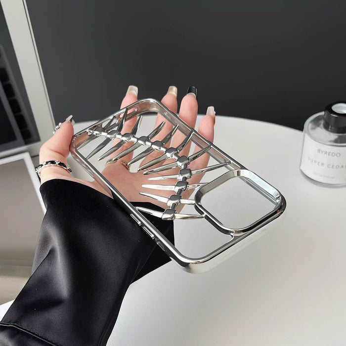Close-up of Hollow Fishbone Phone Case in polish silver, featuring premium silicone and faux leather blend.