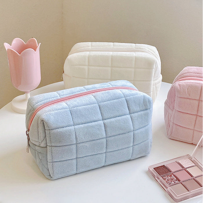 Close-up of Icecream Makeup Bag in blue, easy to pack for trips and daily use.