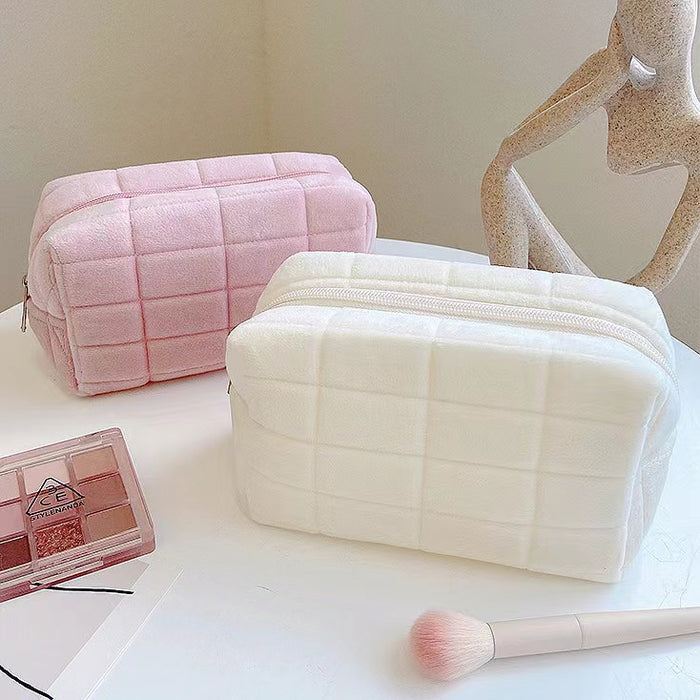 Folded view of Icecream Makeup Bag in white and pink, great for on-the-go touch-ups.