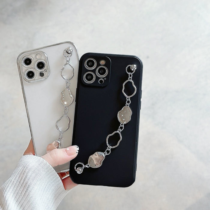 Model holding Irregular Metal Chain Case. Striking metallic attachment on a protective silicone frame.