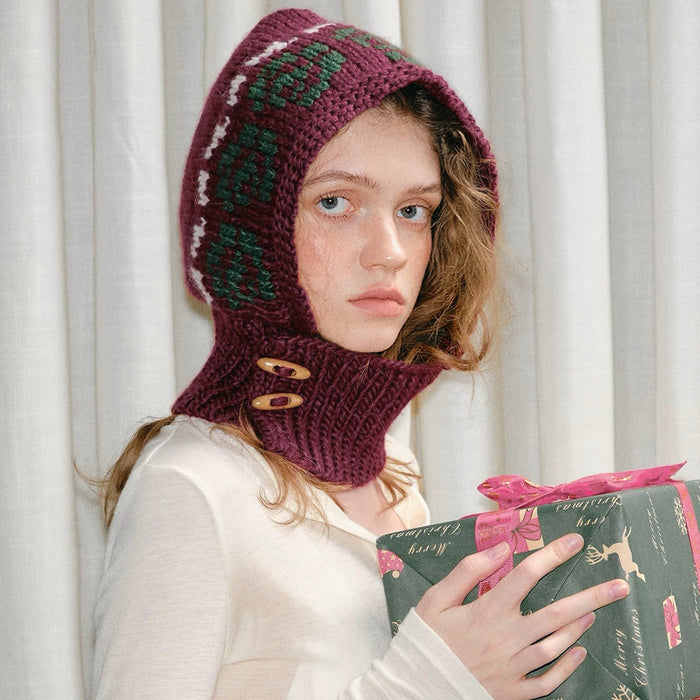 Jacquard knitted wool blend balaclava in burgundy with green patterns and wooden buttons for vintage winter warmth.