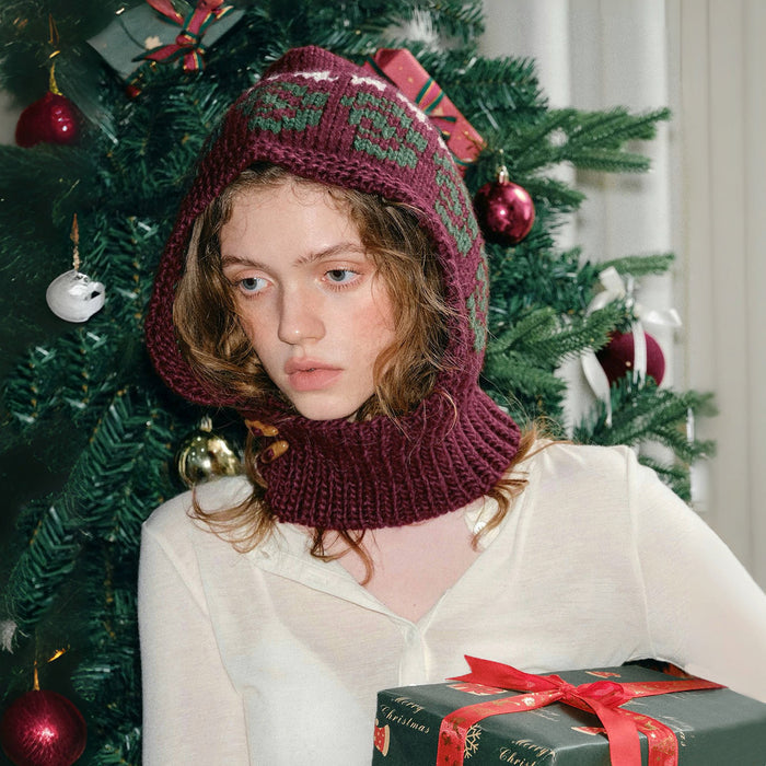 Jacquard knitted balaclava in burgundy wool blend with a festive snowflake pattern, designed for extreme cold.
