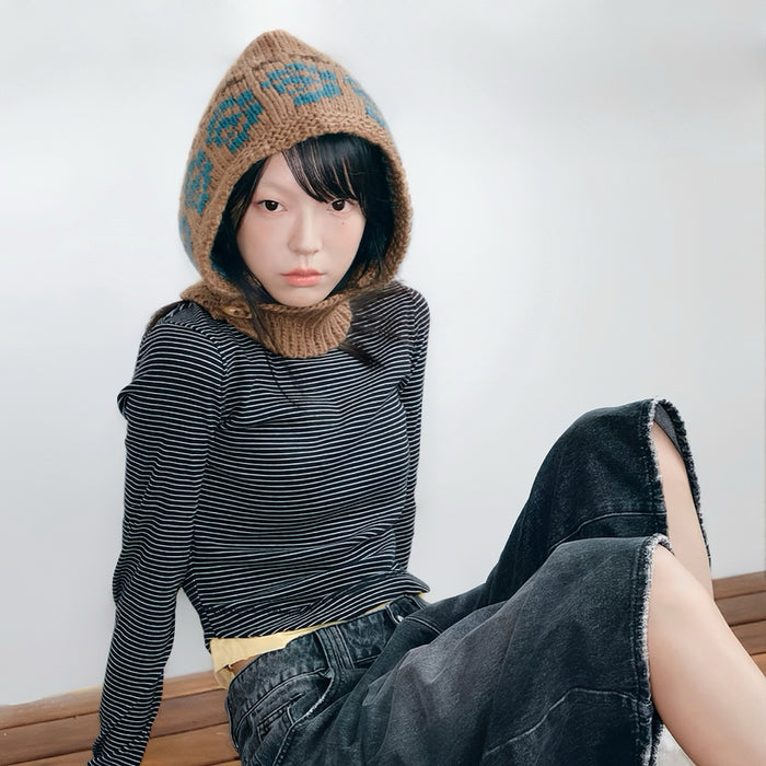 Model wearing Jacquard Knitted Balaclava in khaki, showcasing a cozy natural wool blend with artistic jacquard motifs.