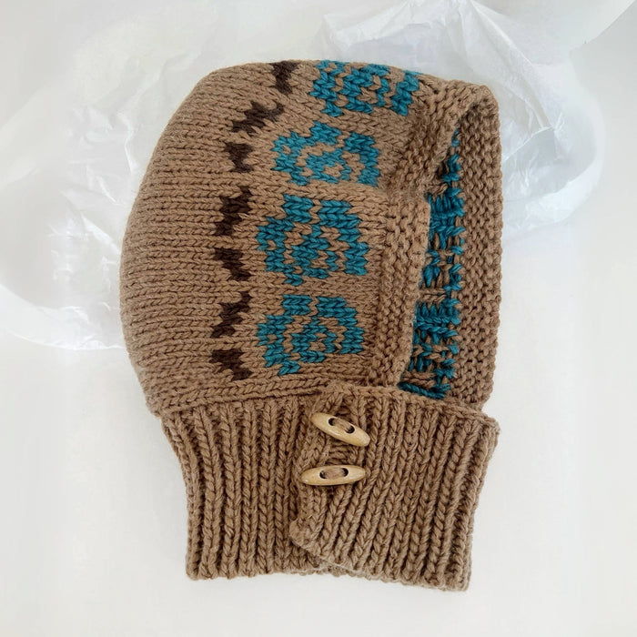 Front view of Jacquard Knitted Balaclava in khaki, knitted from natural wool for a sophisticated outdoor winter look.