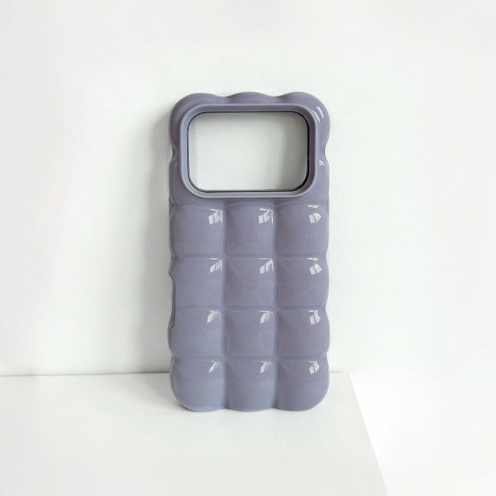 Close-up of a purple jelly case with a high-shine bubble texture.