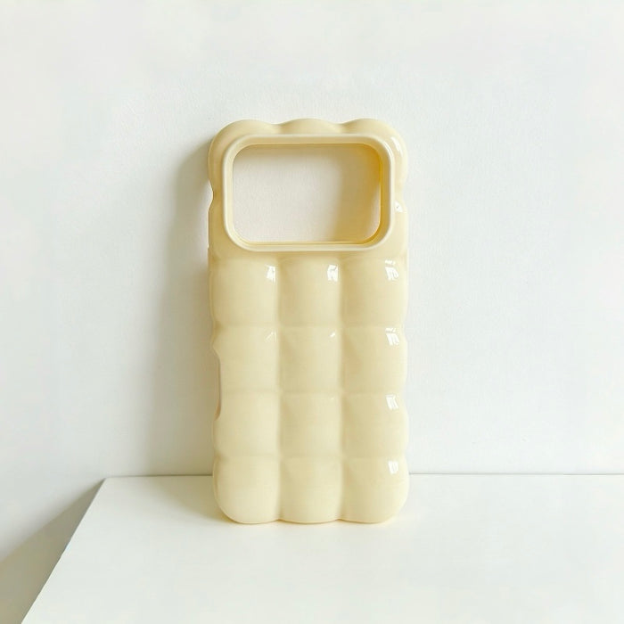 Close-up of a cream yellow jelly bubble phone case with  a macaron hues.