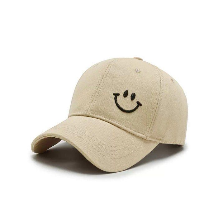 Front view of Joyful Grin Cap in beige, displays iconic smile graphic on soft cotton, ideal for travel and leisure.