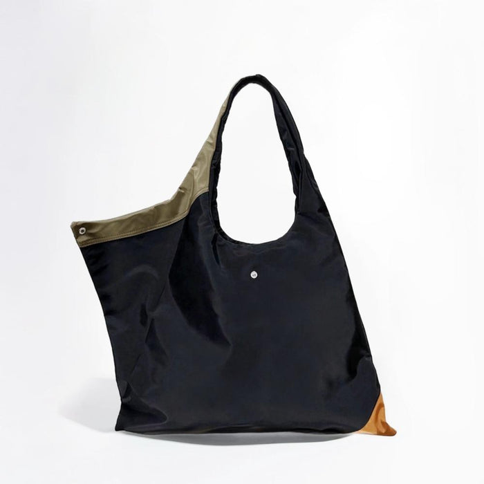 Front view of the Jungle tote bag showcasing the spacious compartment and contrast olive green lining.