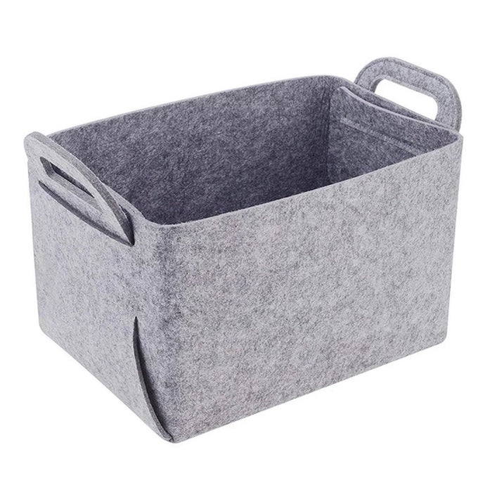 A light grey felt storage basket with cutout handles.