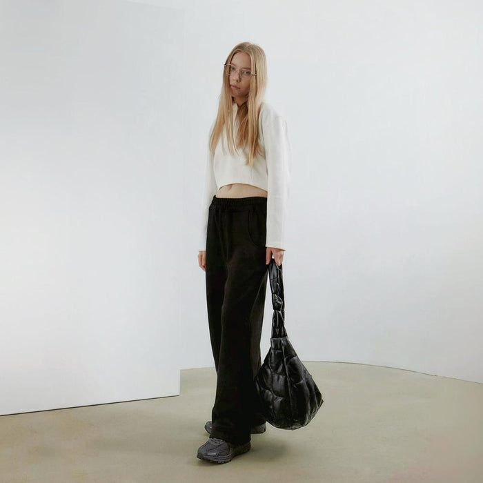 Model carrying a Large Quilted Slouchy Bag handheld, ideal for city walks and gifting.