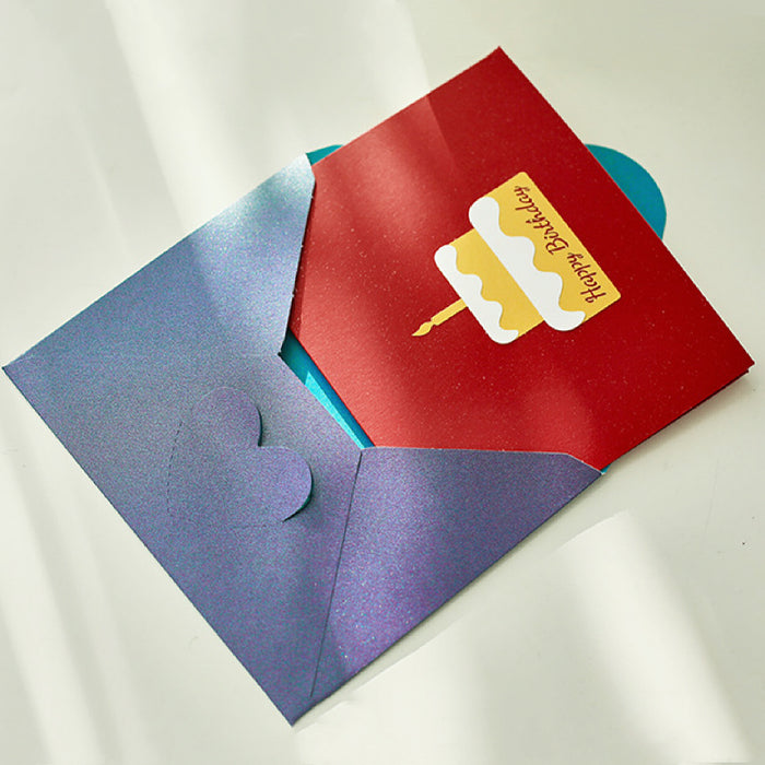 Flat lay of the Cake Birthday Card with a red cover and a printed cake.