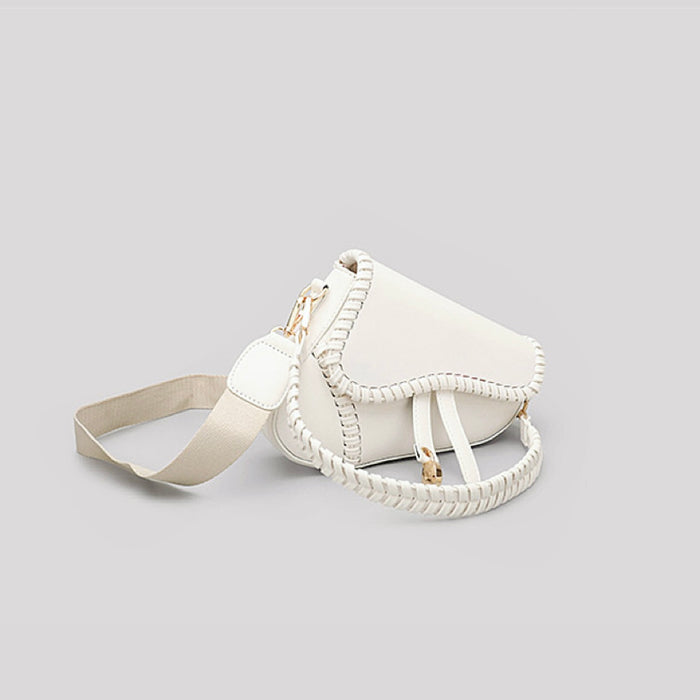 Folded view of Leather Threaded Saddle Bag in white, easy for commuting and weekends.