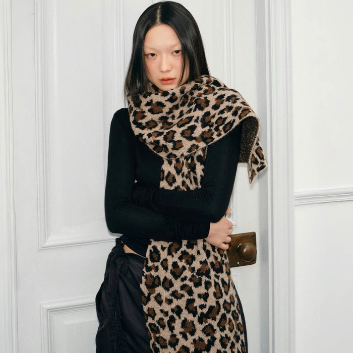 Model wearing long, brown and black leopard print knit wool blend scarf Leopard Print Knit Scarf, ideal for daily.