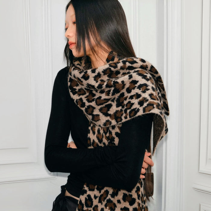 Model wearing a leopard print wool knit scarf Leopard Print Knit Scarf, easy for weekend styling and gifting.